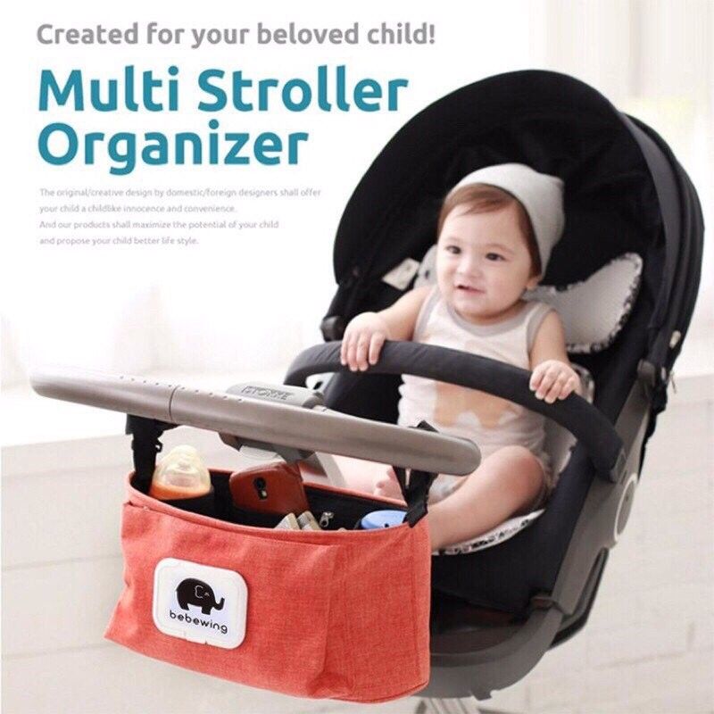 Bebewing Multi Stroller Organizer (Category: Other Babies Going Out Needs) located in Batangas. Submitted by antonina0415 (Listing ID 1308121711, Image 3). Description: Name: Diaper Bags Material: Polyester Color: orange Size: 33*16*13cm Weight: about 245g Features: high quality, stylish, large capacity, suit for 99% stroller • This very handy stroller organizer holds bottles and coffee cups securely, while providing easy access to your most impo