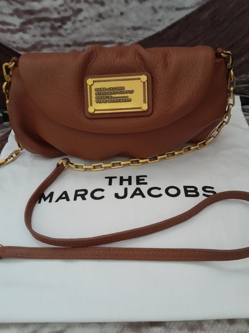 Mark Jacobs Clutch/Wallet/Sling Bag (Category: Luxury Bags & Wallets) located in Quezon City. Submitted by lalaine.r (Listing ID 1307988785, Image 1). Description: 💯 original like new small size clutch or sling bag chain and leather strap genuine leather.