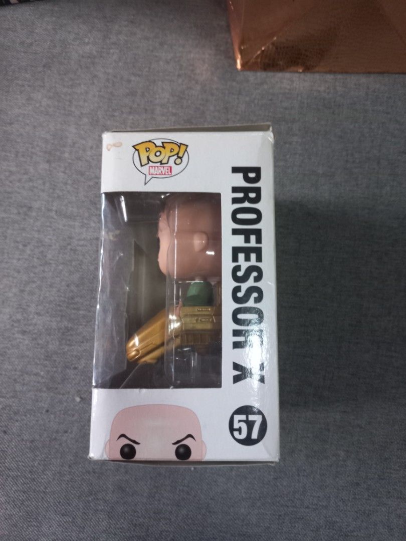 Professor X (57) Funko Pop Bobble Head (Category: Designer & Blind Box Toys) located in Pasay City. Submitted by movingout_lowprices (Listing ID 1308023424, Image 2). Description: box is worn, was opened and displayed. hot chocolate spilled on box, sorry.