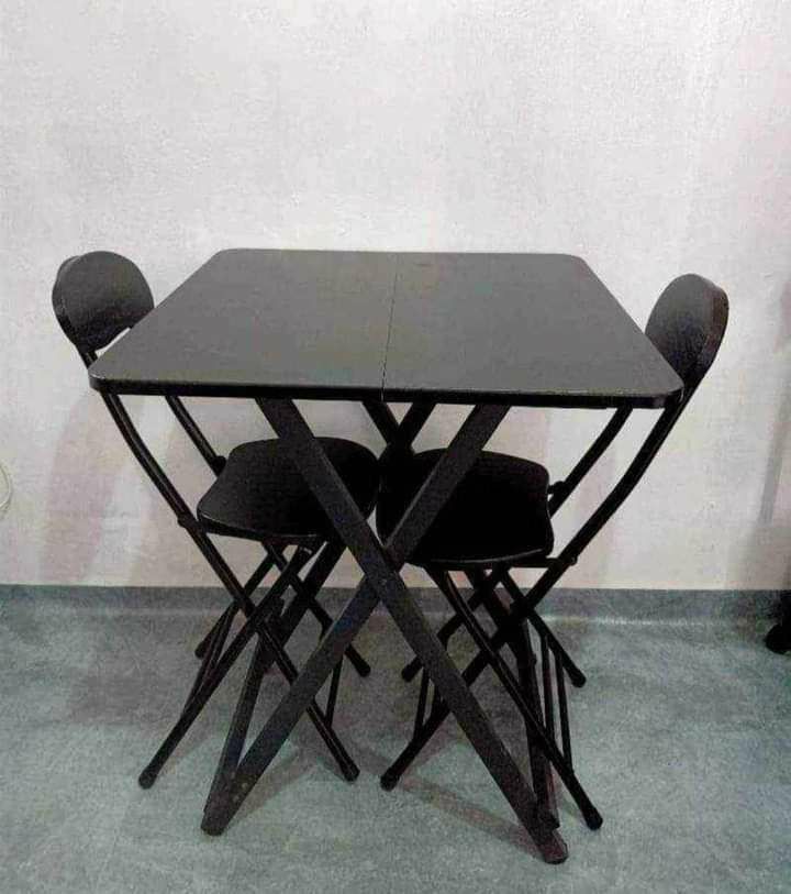 Foldable table en 2 chairs (Category: Tables & Sets) located in Manila. Submitted by saguittarian06 (Listing ID 1308264618, Image 2). Description: FOLDABLE TABLE AND 2 CHAIRS Can be used as breakfast, coffe table or garden table. Available Color: Mahogany, Black & Pink. Table Dimension: 58cm Width x 58cm Length x 70cm Height Inclusion: 1 Table 2 Chairs We do COD / PICK-UP at same day transaction. Open for resellers and bulk orders. Call [hidden i