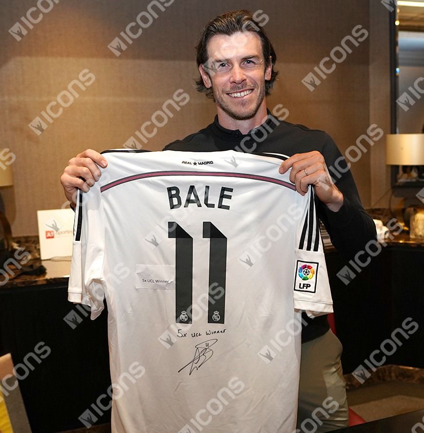 Gareth Bale Back Signed Real Madrid 2014-15 Home Shirt - "5x UCL Winner" Inscription In Hero Frame: Option 1 (Category: Other Merchandise) located in Singapore. Submitted by championasiasports (Listing ID 1308289137, Image 5). Description: This Real Madrid CF shirt was personally signed by Gareth Bale during a private signing session in Surrey on April 19th, 2024. The shirt comes with an official Icons.com Certificate of Authenticity, which serve