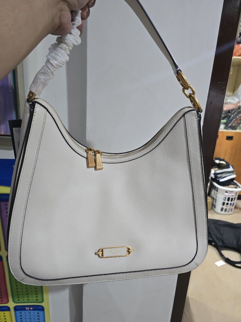 Kate Spade Gramercy Hobo (Category: Luxury Bags & Wallets) located in San Pedro. Submitted by misslumi (Listing ID 1308305483, Image 1). Description: RETAIL BAG from US!! Kate Spade Gramercy Hobo - White Inclusions: ✅️ Dustbag, tags, paper bag, polyplastic 13.8”h x 11.8”w x 3.3"​d Strap drop: 11" Pebbled leather with PU trim Microsuede lining Plaque logo Hobo bag with zip closure Interior zip pocket Interior slip pocket Fits current iPhone, ipad.
