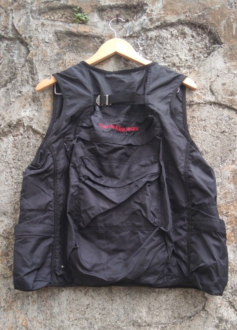 VINTAGE CALVIN KLEIN JEANS BACKPACK VEST 2000's Black Medium (Category: Activewear) located in Marikina City. Submitted by windeq15 (Listing ID 1308158556, Image 2). Description: Vintage 2000's Calvin Klein Jeans Backpack Vest Medium on tag in Black color Made in Sri Lanka 100% Nylon It has multiple pockets. three Front pocket two side pocket three Back pocket ( 2 big, 1 small ) Dimensions pit to pit - 21 inches tip to tip - 24 inches No Issues, 