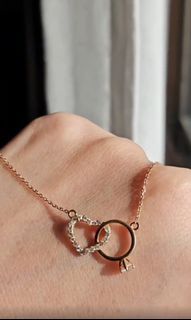 18K rose gold necklace with intertwined heart and solitaire ring