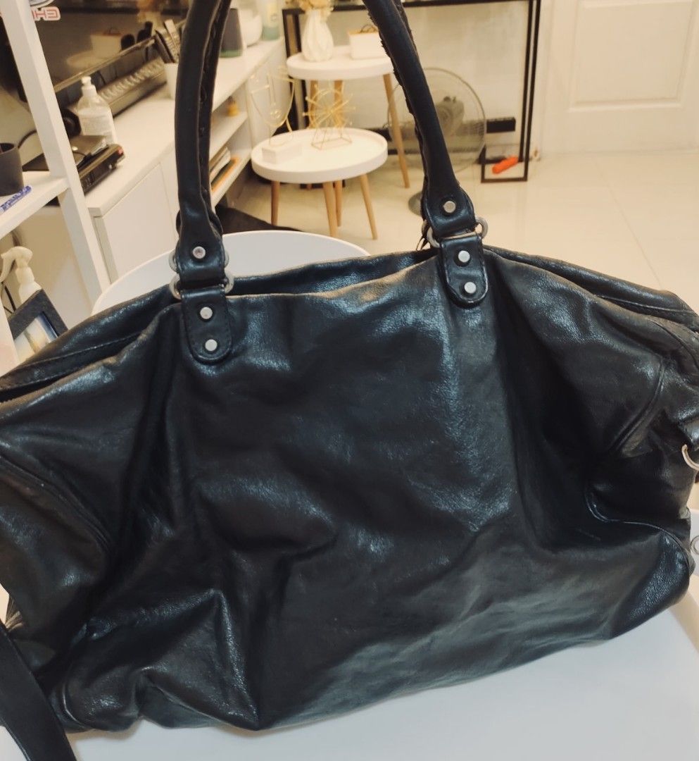 Authentic Balenciaga Weekender Bag w/ lock and keys (Category: Luxury Bags & Wallets) located in Quezon City. Submitted by val3301 (Listing ID 1308389888, Image 2). Description: Authentic Balenciaga Weekender Bag w/ lock and keys - Length: 48 cm / 19 in - Height: 33 cm / 13 in - Width: 18 cm / 7 in.