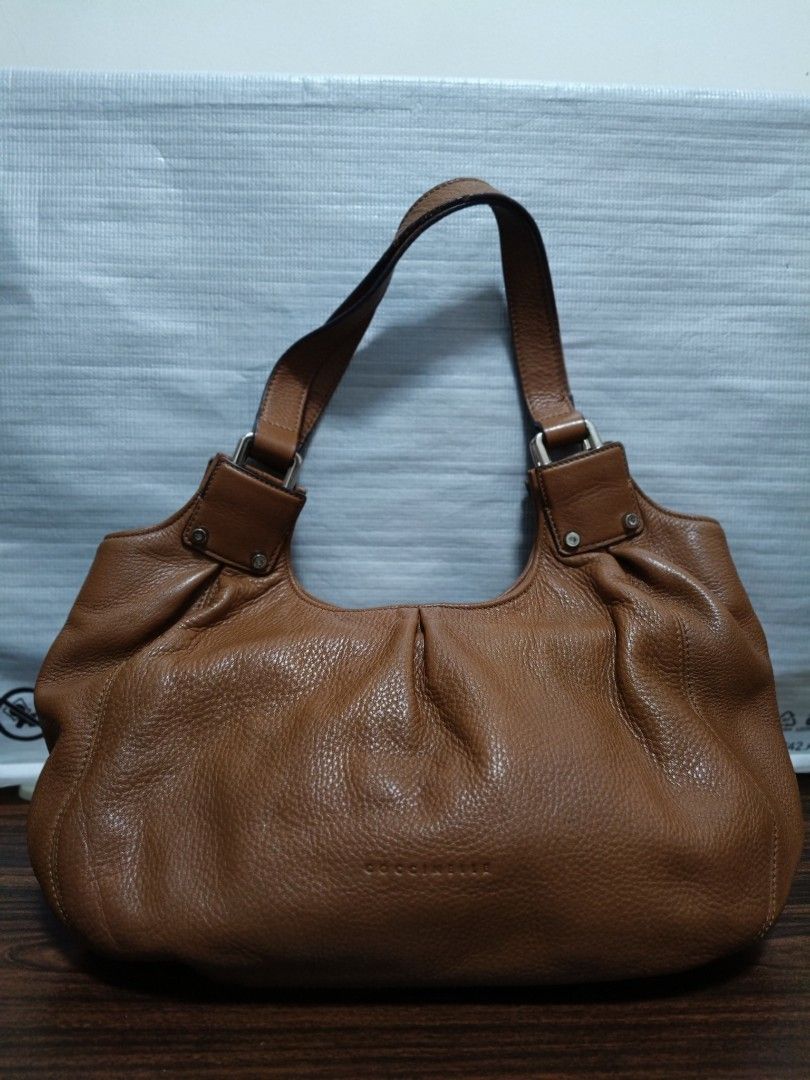 Coccinelle Shoulder/Handbag (Category: Luxury Bags & Wallets) located in Batangas. Submitted by lynmejlight (Listing ID 1308402289, Image 1). Description: Original Coccinelle Shoulder/Handbag. Npakaganda Ng leather, no crackings. Very nice ang color sa personal. Sign of used sa rubber lining Ng strap at very small dot Ng stain sa body na hindi Naman halata..