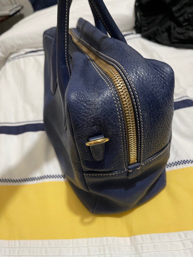 Prada Bag (Category: Luxury Bags & Wallets) located in Quezon City. Submitted by pathdz (Listing ID 1308394328, Image 3). Description: With minor flaws as seen in the photo With dust bag, care card (Authentication), padlock Long strap.
