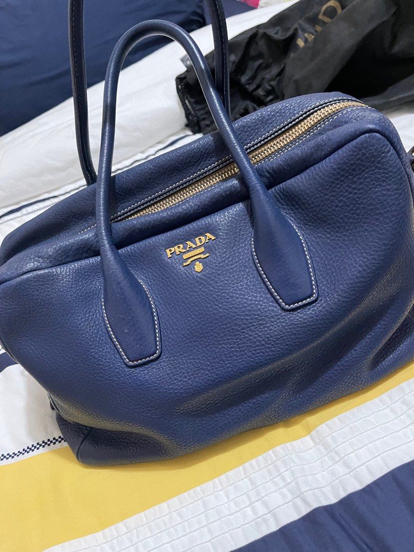 Prada Bag (Category: Luxury Bags & Wallets) located in Quezon City. Submitted by pathdz (Listing ID 1308394328, Image 1). Description: With minor flaws as seen in the photo With dust bag, care card (Authentication), padlock Long strap.