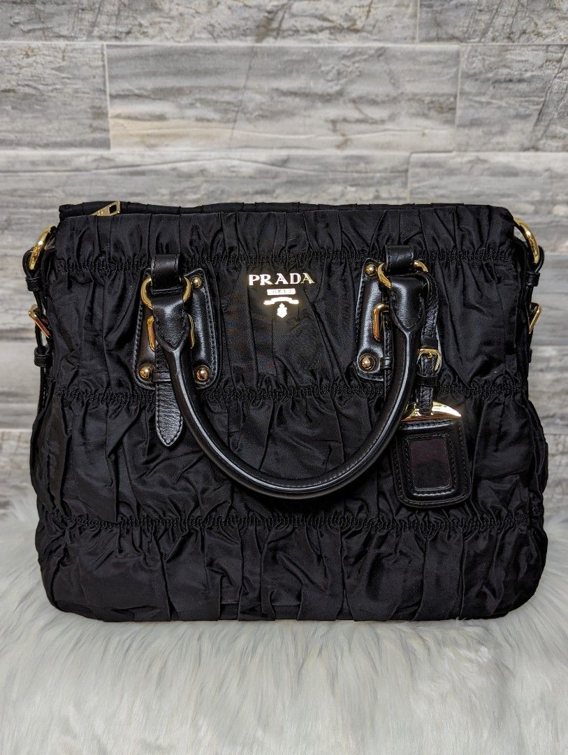 Prada BR5116 Tessuto Soft Calfskin (Category: Luxury Bags & Wallets) located in Manila. Submitted by facet.ornament (Listing ID 1308441933, Image 1). Description: Prada BR116 Tessuto Soft Calfskin Nero Bag in Gold hardware Made in Italy with dust bag, detachable sling strap, care cards Like new Seldom used Gold hardware in prestine condition No rubs on the handle and sides.
