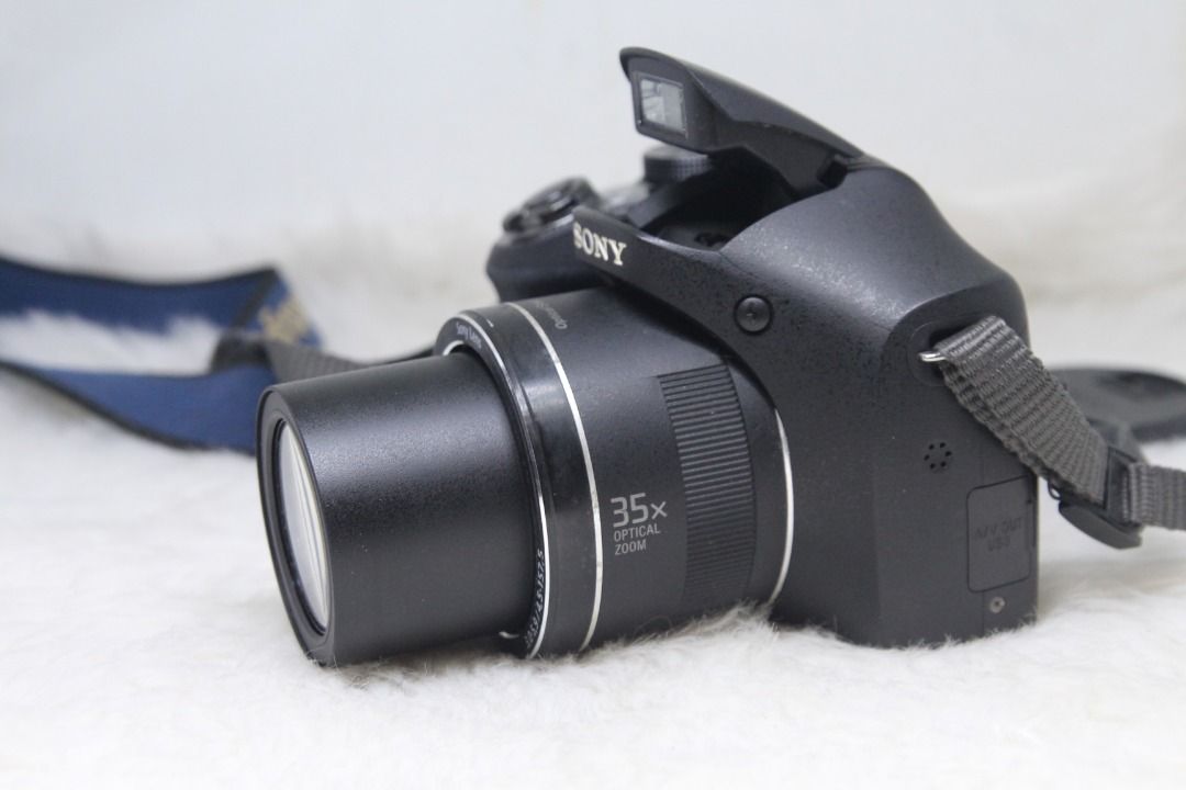 Sony Cyber-shot DSC-H300 20.1 MP CCD sensor Digital Camera (Category: Cameras) located in Manila. Submitted by ultimogizmos (Listing ID 1308340949, Image 2). Description: Sony Cyber-shot DSC-H300 20.1 MP Digital Camera About this item 20.1 megapixel plus 35x zoom brings detailed subjects close - 3.0" LCD screen for easy viewing and photo editing Optical SteadyShot image stabilization reduces blur Capture your videos in 720p HD Movie mode CCD sens