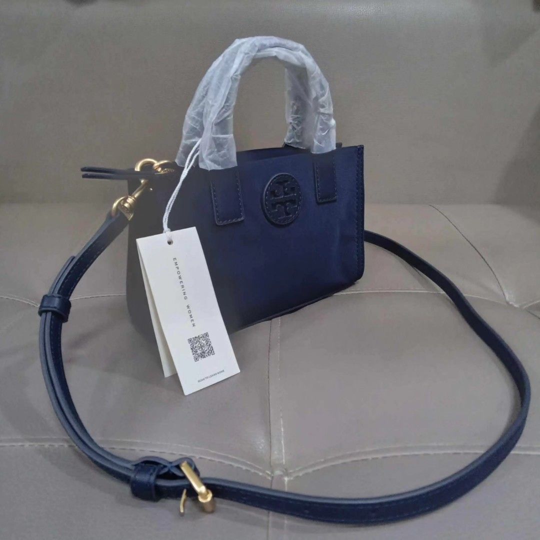 Tory Burch Ella Mini Crossbody (Category: Luxury Bags & Wallets) located in Taguig. Submitted by esa.agustin (Listing ID 1308374323, Image 2). Description: Original Tory Burch Mini Ella navy blue nylon crossbody bag. With tag and paper bag..