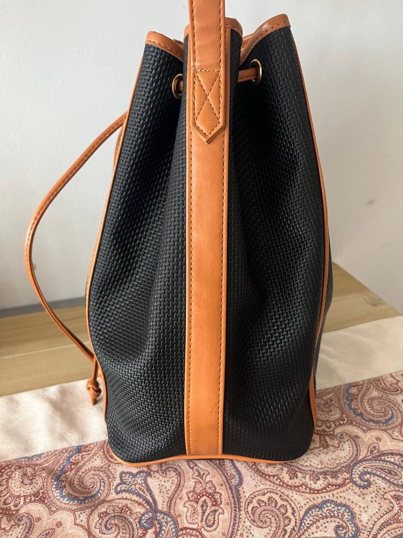 YSL Vintage Drawstring Bucket Bag (Category: Luxury Bags & Wallets) located in Bulacan. Submitted by thedeclutteringmom (Listing ID 1308387185, Image 3). Description: Guaranteed original Moneyback if proven fake In good condition With signs of use on top lining and strap Combination of PVC and leather Clean inside, no sticky or foul smell Classic and versatile Durable bag.