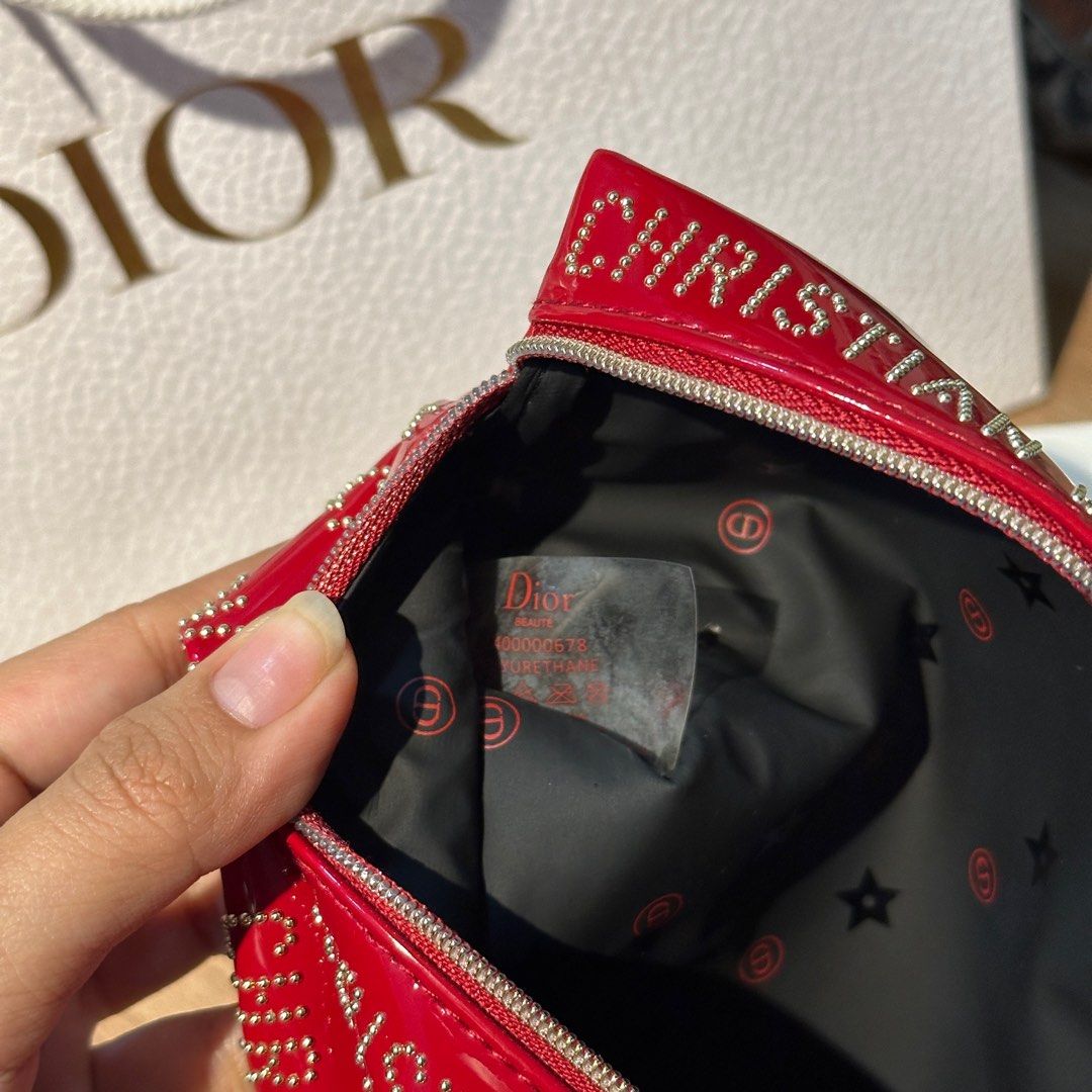 DIOR RED STUDDED POUCH CNY EXCLUSIVE ♥️ (Category: Luxury Bags & Wallets) located in Rizal. Submitted by thetopspotfashionboutique (Listing ID 1308655263, Image 2). Description: - WITH INNER TAGS / ETIKETA - COMPLIMENTARY GIFT / GIFT WITH PURCHASE - WITH ORIGINAL DIOR PAPERBAG - ORIGINAL BOX INCLUDED Measurement: 20x12cm .