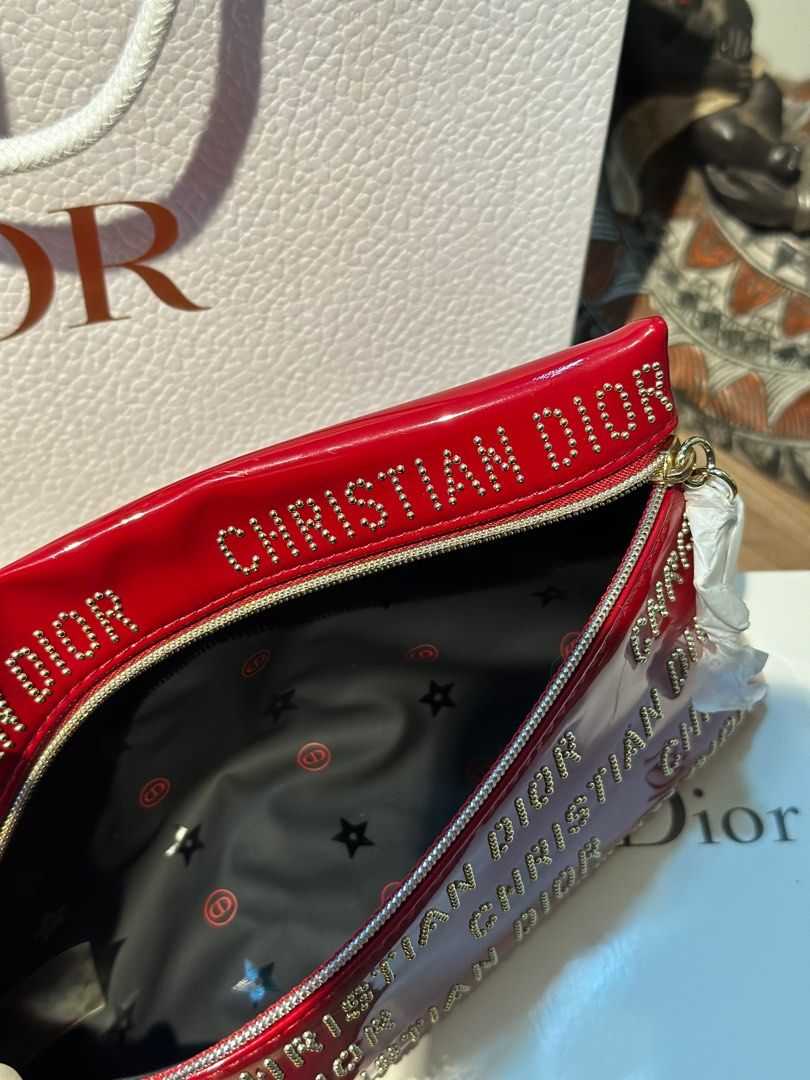 DIOR RED STUDDED POUCH CNY EXCLUSIVE ♥️ (Category: Luxury Bags & Wallets) located in Rizal. Submitted by thetopspotfashionboutique (Listing ID 1308655263, Image 3). Description: - WITH INNER TAGS / ETIKETA - COMPLIMENTARY GIFT / GIFT WITH PURCHASE - WITH ORIGINAL DIOR PAPERBAG - ORIGINAL BOX INCLUDED Measurement: 20x12cm .