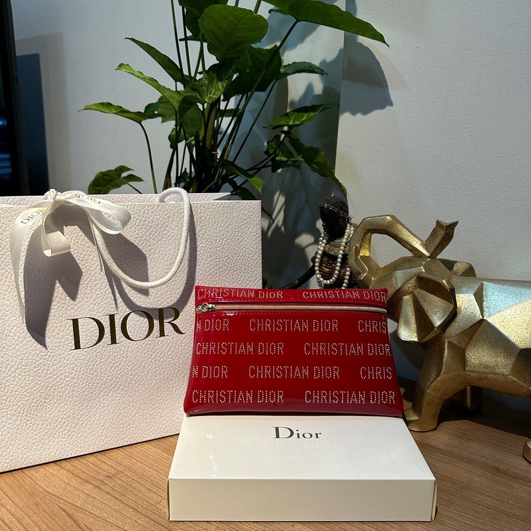 DIOR RED STUDDED POUCH CNY EXCLUSIVE ♥️ (Category: Luxury Bags & Wallets) located in Rizal. Submitted by thetopspotfashionboutique (Listing ID 1308655263, Image 1). Description: - WITH INNER TAGS / ETIKETA - COMPLIMENTARY GIFT / GIFT WITH PURCHASE - WITH ORIGINAL DIOR PAPERBAG - ORIGINAL BOX INCLUDED Measurement: 20x12cm .