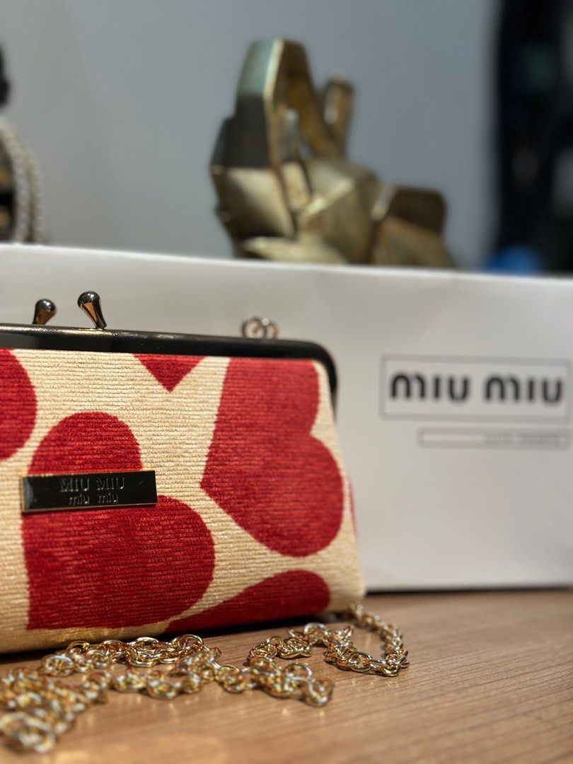 MIUMIU SLING POUCH WITH HEART PRINTS ♥️ (Category: Luxury Bags & Wallets) located in Rizal. Submitted by thetopspotfashionboutique (Listing ID 1308654554, Image 2). Description: - WITH ORIGINAL MIUMIU PARFUMS BOX - COMPLIMENTARY GIFT / GIFT WITH PURCHASE - BRAND NEW Measurement: 21x10cm.