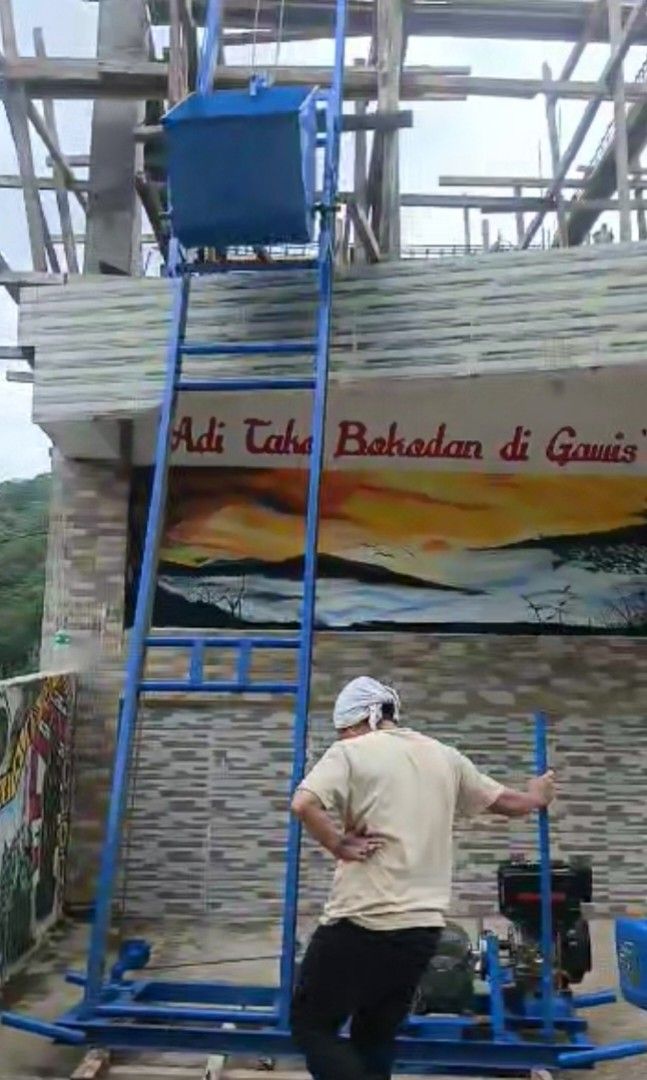 Portalift (Category: Construction & Building Materials) located in Quezon City. Submitted by dadadeyn (Listing ID 1083992261, Image 3). Description: PORTALIFT (4 Ladders) 82k DIESEL ENGINE Channel bar 2x4x4mm 3meters per ladder Lifter Bucket 7 cubic ft. Gear Box w/ Cable Drum 12Hp Diesel Yamma Engine Engine Base w/ Ground Pulley Complete accessories ready to use Free installation.