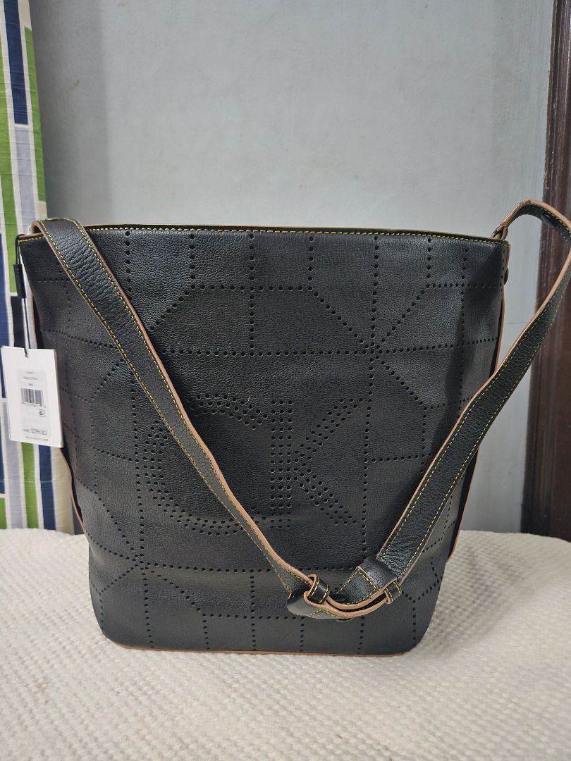 Calvin Klein Shelby Pebble Large Hobo (Category: Luxury Bags & Wallets) located in Makati City. Submitted by KuWeLaDevil01 (Listing ID 1308925888, Image 2). Description: All Authentic, never used with original strap and brass hardware (it’s still wrapped). The geometric perforations is a Calvin Klein hobo signature and has a magnetic snap closure. The leather is rugged but feels very nice to brush your palms on. Main compartment is huge; it can f