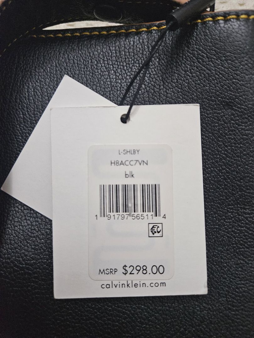 Calvin Klein Shelby Pebble Large Hobo (Category: Luxury Bags & Wallets) located in Makati City. Submitted by KuWeLaDevil01 (Listing ID 1308925888, Image 3). Description: All Authentic, never used with original strap and brass hardware (it’s still wrapped). The geometric perforations is a Calvin Klein hobo signature and has a magnetic snap closure. The leather is rugged but feels very nice to brush your palms on. Main compartment is huge; it can f