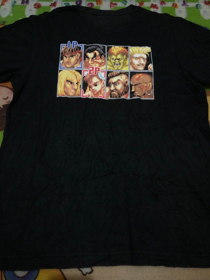 Capcom x Uniqlo (Gaming Shirt) (Category: Tshirts & Polo Shirts ) located in Tuguegarao City. Submitted by emdisplay (Listing ID 1308951790, Image 2). Description: Street Fighter Uniqlo tag (Legit/Authentic) 19.5x25.5 / Small - Medium Flaws: Faded sa batok part at needs wash narin..