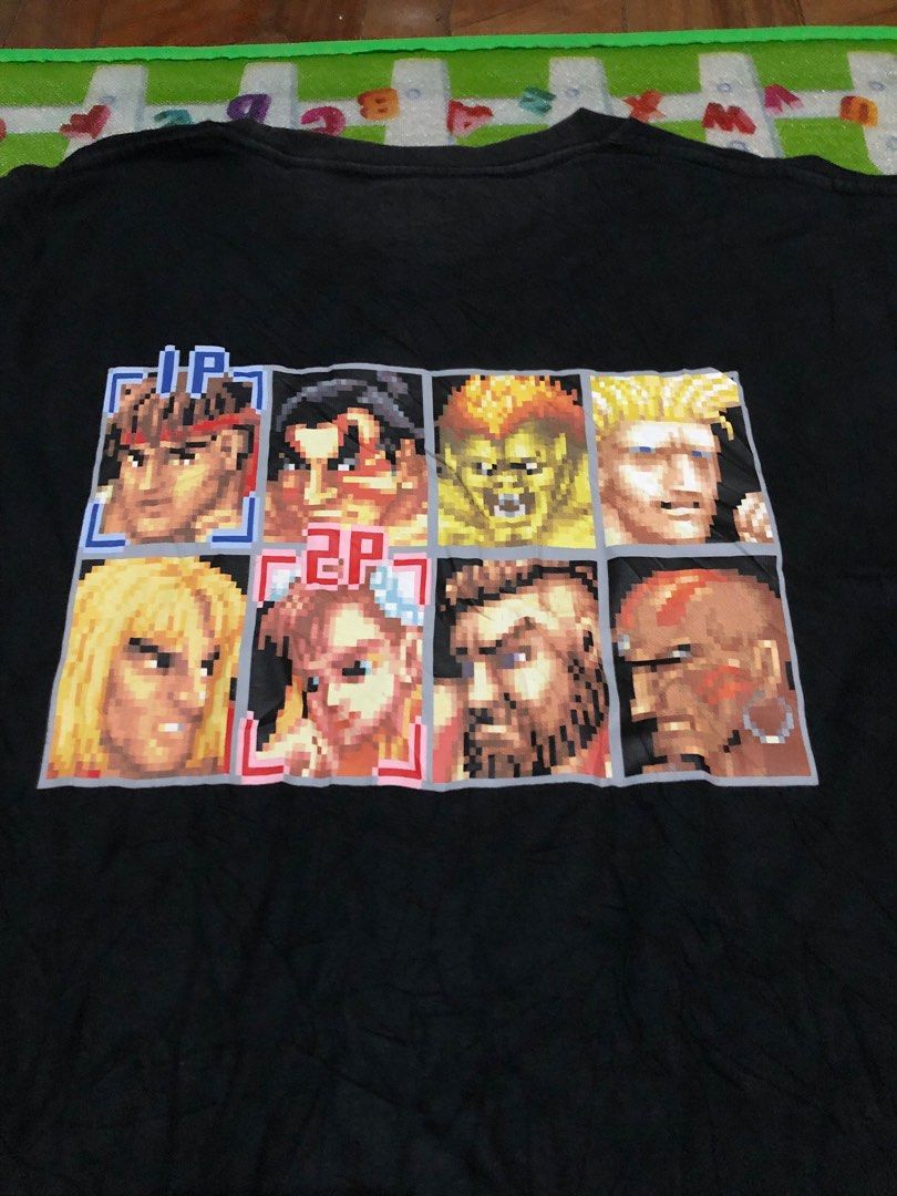 Capcom x Uniqlo (Gaming Shirt) (Category: Tshirts & Polo Shirts ) located in Tuguegarao City. Submitted by emdisplay (Listing ID 1308951790, Image 1). Description: Street Fighter Uniqlo tag (Legit/Authentic) 19.5x25.5 / Small - Medium Flaws: Faded sa batok part at needs wash narin..