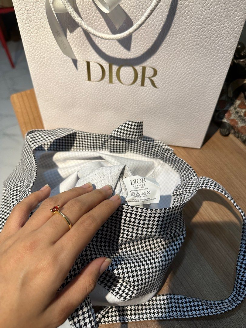 DIOR BEAUTE HOUNDSTOOTH TOTE BAG 🖤 (Category: Luxury Bags & Wallets) located in Rizal. Submitted by thetopspotfashionboutique (Listing ID 1308843049, Image 2). Description: - WITH INNER TAGS / ETIKETA - COMPLIMENTARY GIFT / GIFT WITH PURCHASE - WITH ORIGINAL DIOR PAPERBAG - ORIGINAL SEALED PLASTIC INCLUDED Measurement: 33x37cm .