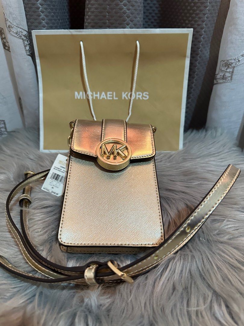 Michael Kors bags (Category: Luxury Bags & Wallets) located in Angeles City. Submitted by catladyluna (Listing ID 1308919142, Image 1). Description: Phone Sling - 3300.