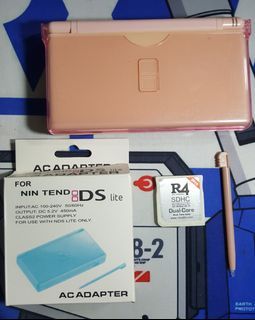 Pink Nintendo DS Lite with R4 games and charger.