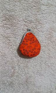 Really small orange jewelry kisslock purse