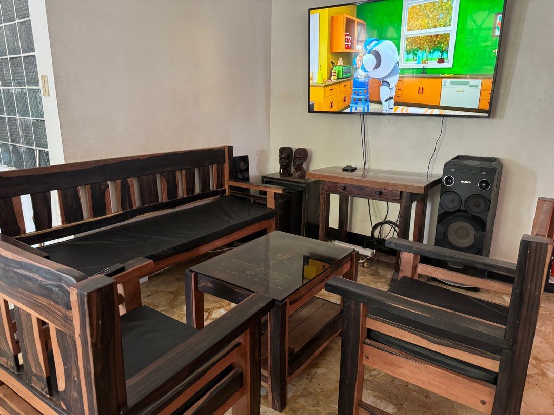 Solid ebony / kamagong sofa sala set. (Category: Sofas) located in Pasig City. Submitted by rellizulueta (Listing ID 1308862901, Image 1). Description: Solid ebony / kamagong sofa sala set 5 pcs include 1 console, 1 center table, 1 sofa , 2 single oversize chair..
