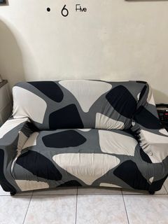 Two-seater leather sofa with free seat cover (on photo)