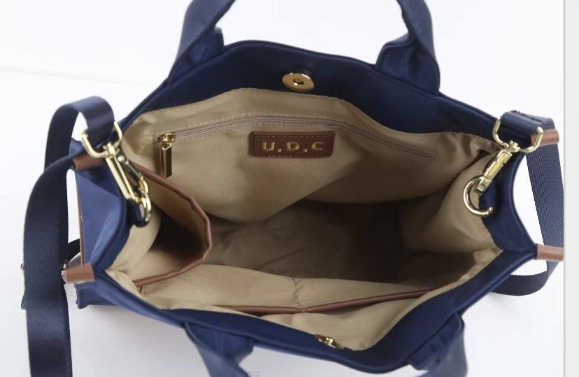 UDC Cross body bag (Category: Cross-body Bags) located in Taguig. Submitted by grayanna (Listing ID 1308959407, Image 3). Description: Brand new UDC tote / cross body bag with bag (kindly check UDC sa online original price 1,3++) RFS: wrong color.