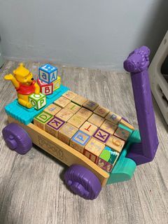 Wooden cart with alphabet blocks