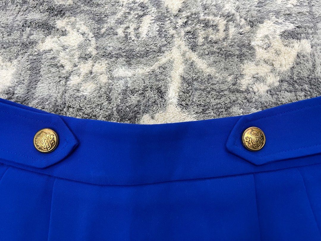 Zara Royal Blue Skort (Category: Shorts) located in Pasay City. Submitted by netuy (Listing ID 1308863843, Image 3). Description: Royal blue with gold buttons. Size small. Thick chiffon-like material. Flowy skort. Back zipper. No pockets. .
