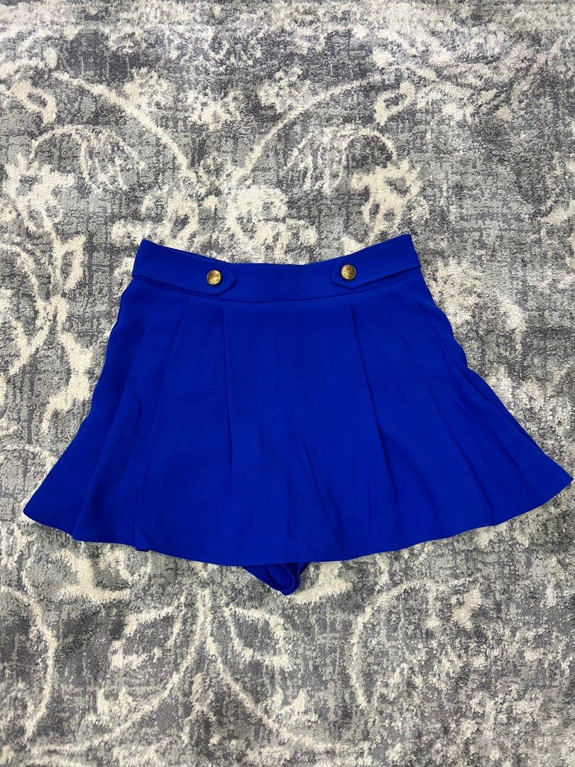 Zara Royal Blue Skort (Category: Shorts) located in Pasay City. Submitted by netuy (Listing ID 1308863843, Image 1). Description: Royal blue with gold buttons. Size small. Thick chiffon-like material. Flowy skort. Back zipper. No pockets. .