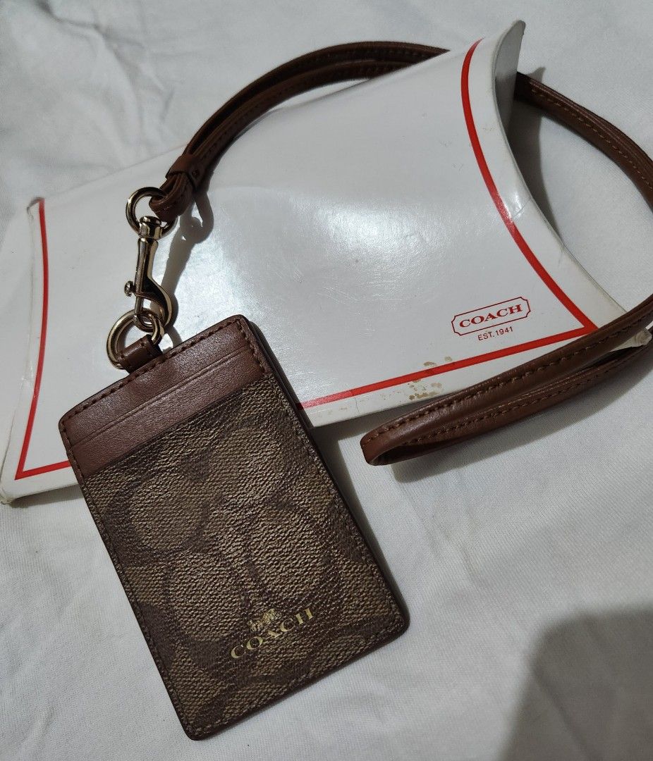 Coach ID Lanyard (Category: Other Accessories) located in Mandaluyong City. Submitted by grachi (Listing ID 1309115210, Image 3). Description: Coach ID Lanyard brown and gold from US price in Zalora is 5k+ but selling it for half the price since it is slightly used.