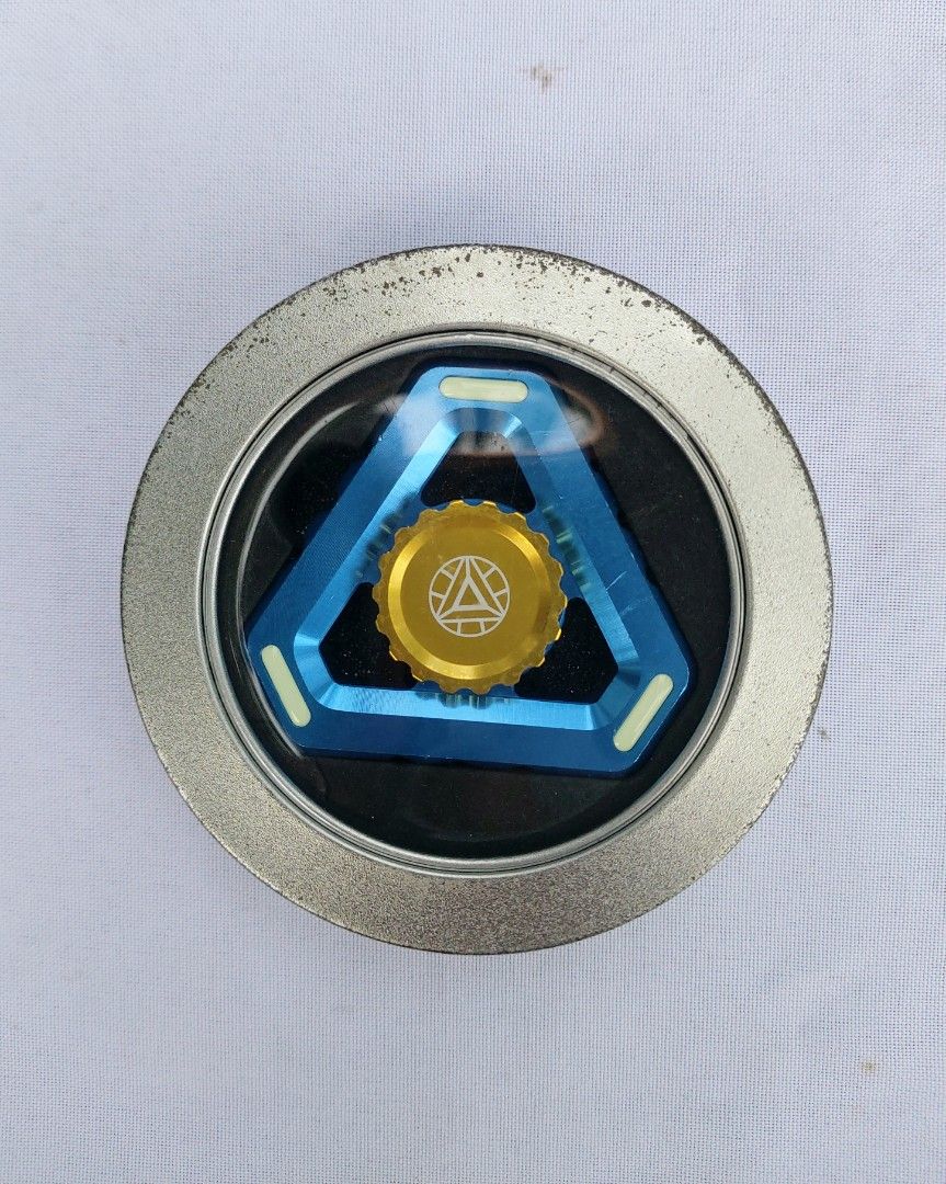 Metal Fidget Spinner with container (Category: Action & Battle Toys) located in Lapu Lapu. Submitted by agnesapm_29813 (Listing ID 1309155790, Image 1). Description: Still in very good condition. Glow in the dark spinner..