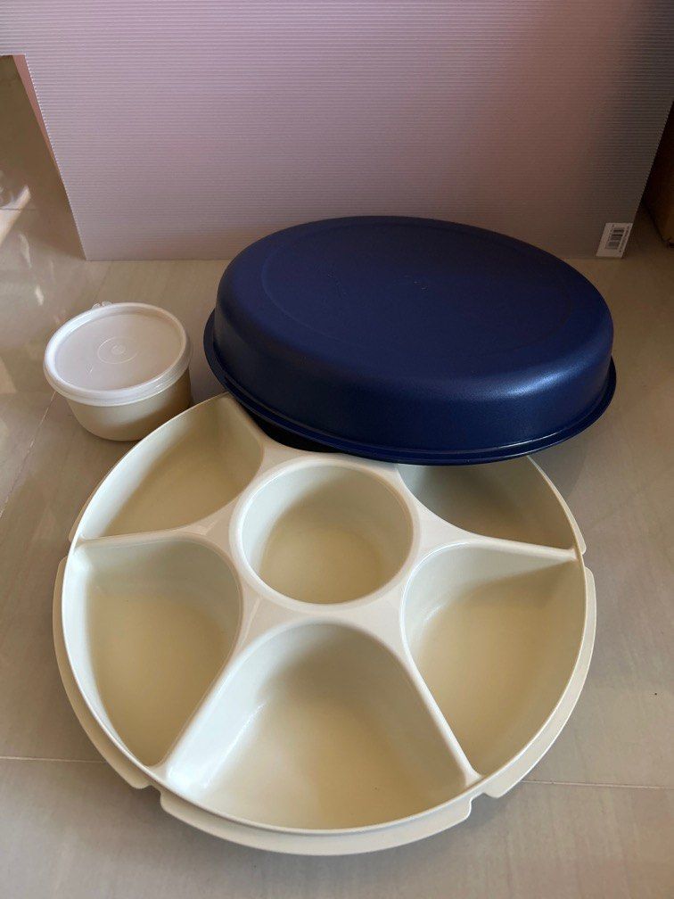 Tupperware Serving Centre (Category: Food Organisation & Storage) located in Singapore. Submitted by baberyn (Listing ID 1309105024, Image 2). Description: Food storage suitable for any party, it keeps condiments organised and separated. - BPA Free - Removal middle container, easy to refill - cover can be use as second tray Diameter 34.5 x 9.5 H.