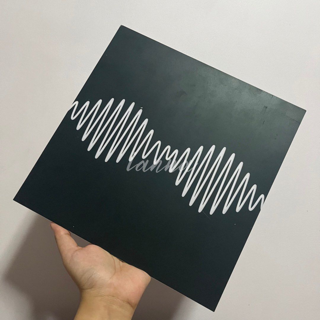 Arctic Monkeys Album Vinyl-Style Display (Category: Vinyls) located in Cavite. Submitted by iannav. (Listing ID 1309309787, Image 1). Description: - Size: 10 × 10 - This is a fan-made vinyl-style wall. display. Print material: UV Print on Sintra Board. Has 3 mm thickness. It has flaws (marks, dirt, scratches, etc.) - Rfs: Decluttering - I’ll be using used/recycled papers for packaging. - Buyer will shoulder the shipping fee. - MOP: BDO (If you’re