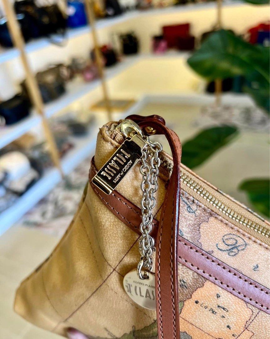 Auth Alviero Martini Sling Bag (Category: Luxury Bags & Wallets) located in Baguio. Submitted by asna_taku (Listing ID 1309256462, Image 2). Description: Auth Alv!ero Martini Sling Bag Excellent used condition to like new Coated canvas & genuine leather.