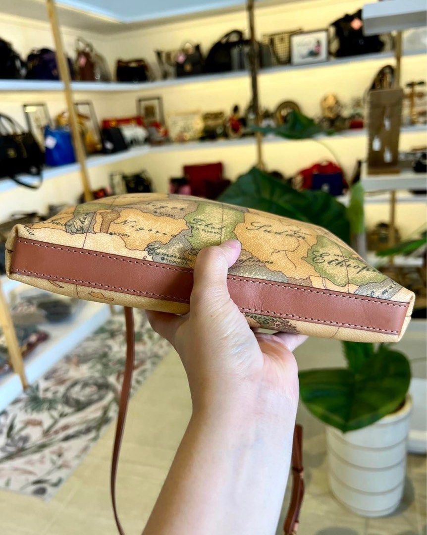 Auth Alviero Martini Sling Bag (Category: Luxury Bags & Wallets) located in Baguio. Submitted by asna_taku (Listing ID 1309256462, Image 3). Description: Auth Alv!ero Martini Sling Bag Excellent used condition to like new Coated canvas & genuine leather.