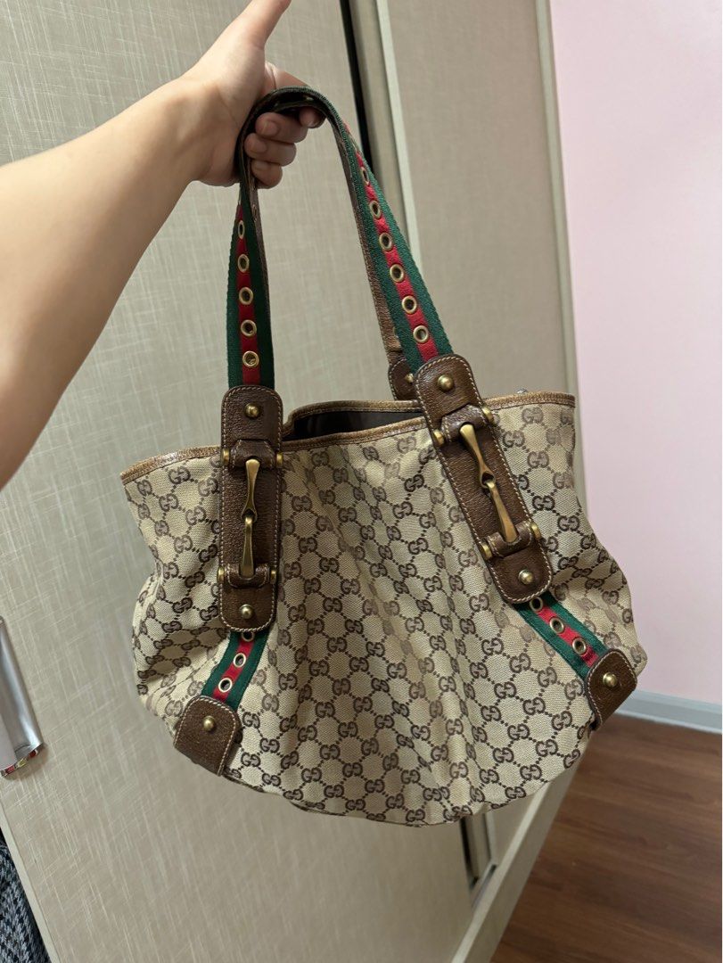Authentic Gucci Cherry Line Shoulder Bag (Category: Luxury Bags & Wallets) located in Manila. Submitted by ganned (Listing ID 1309350139, Image 1). Description: Authentic Gucci Cherry Line Shoulder Bag Bought from Japan. Signs of use all shown in the photo. Very sturdy handbag. Can fit lots of things inside. Clean interior. Slightly negotiable.