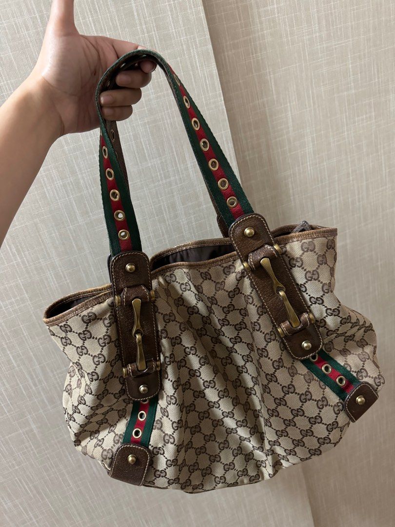 Authentic Gucci Cherry Line Shoulder Bag (Category: Luxury Bags & Wallets) located in Manila. Submitted by ganned (Listing ID 1309350139, Image 2). Description: Authentic Gucci Cherry Line Shoulder Bag Bought from Japan. Signs of use all shown in the photo. Very sturdy handbag. Can fit lots of things inside. Clean interior. Slightly negotiable.