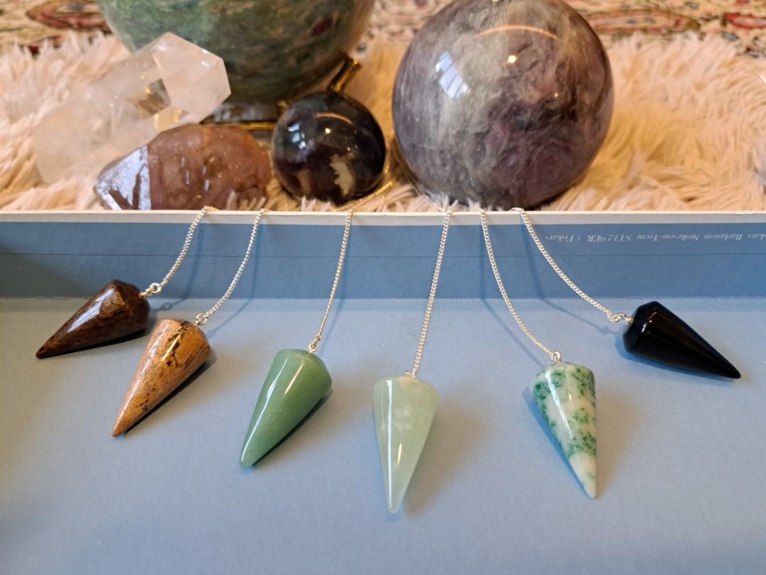 Pendulum (Category: Precious Stones) located in Singapore. Submitted by crystalwissard (Listing ID 1309218859, Image 3). Description: various crystal pendulums for sale. Brand new pendulums in various semi precious minerals red jasper rose quartz - sold New jade African jade blue aventurine picture jasper black obsidian orange calcite clear quartz - sold chocolate calcite 9 sets of pendulums in emerald.
