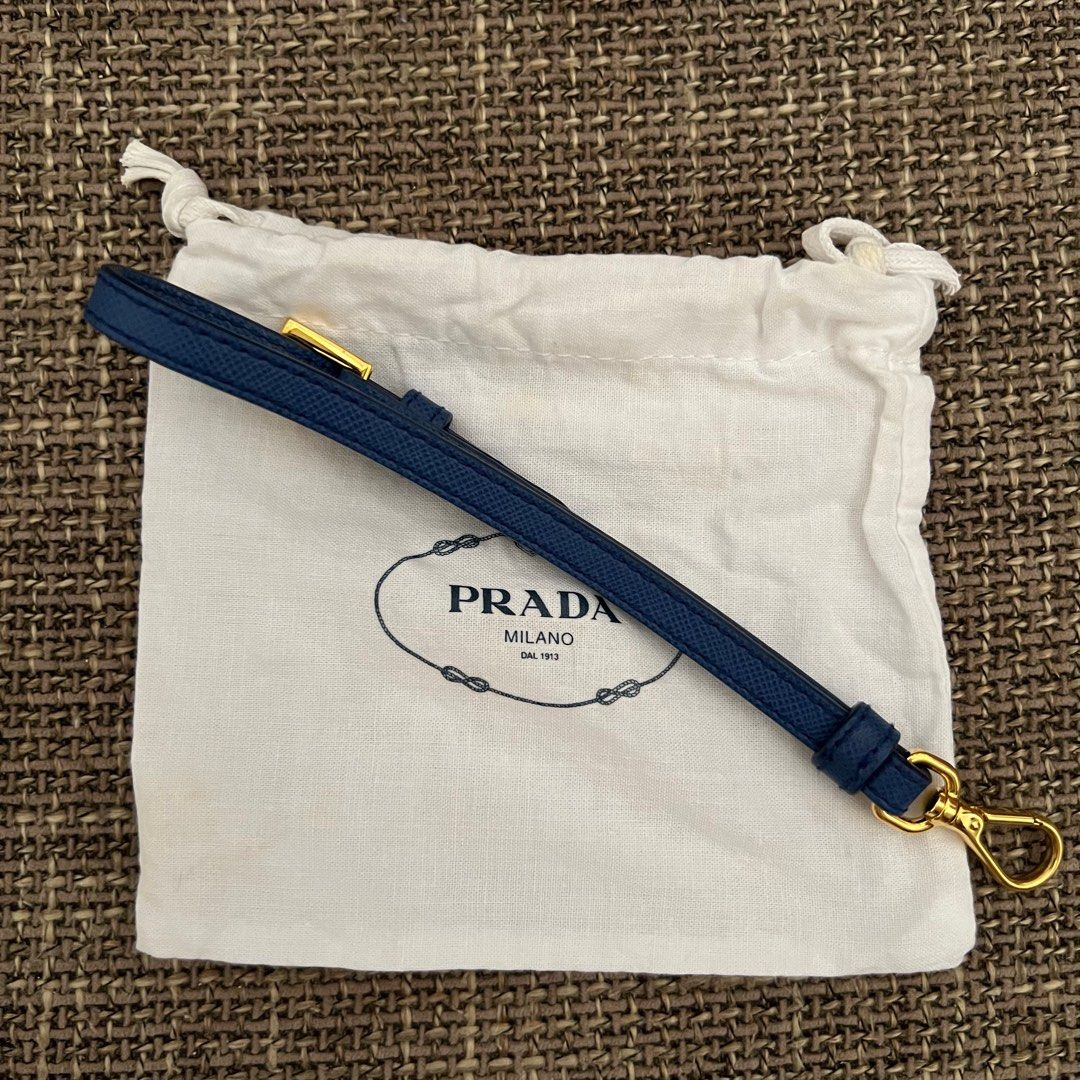 Prada wristlet or celphone holder (Category: Luxury Bags & Wallets) located in Antipolo. Submitted by starstyleph (Listing ID 1309231974, Image 3). Description: Can be used as wristlet, key chain, or celphone holder Made of saffiano leather in gold hardware.