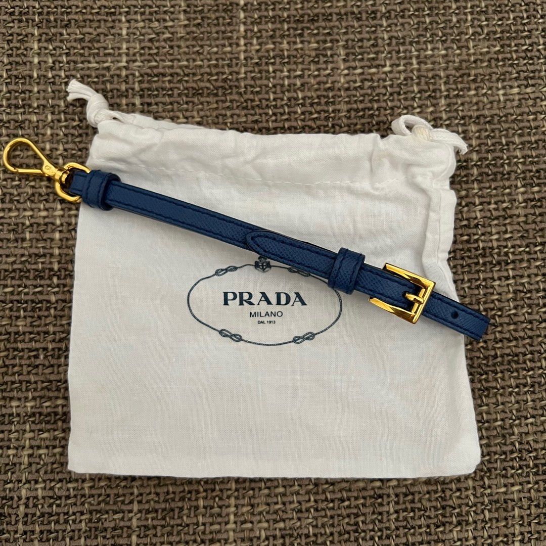 Prada wristlet or celphone holder (Category: Luxury Bags & Wallets) located in Antipolo. Submitted by starstyleph (Listing ID 1309231974, Image 1). Description: Can be used as wristlet, key chain, or celphone holder Made of saffiano leather in gold hardware.