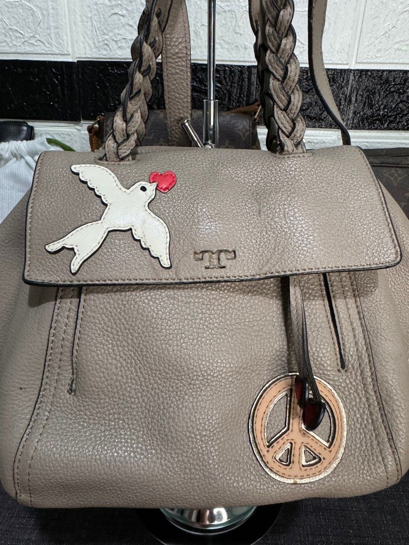 Tory Burch 2way Shoulder Bag Half Moon (Category: Luxury Bags & Wallets) located in Dagupan City. Submitted by luckyluxbyemgee (Listing ID 1309316786, Image 3). Description: Authentic Tory Burch 💯‼️ Moneyback if proven fake The Peace Embellished Half-Moon Small Satchel Pebbled leather * Double zipper closure * Flat handles with braided detailing; 4.98" (12.5 cm) drop * Adjustable, removable cross-body strap with 23.3" (58.5 cm) drop * 1 exterior