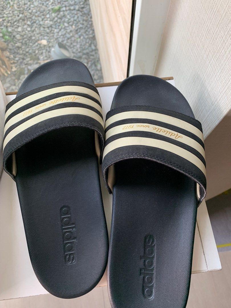 Adidas Adilette Comfort Slides Black (Category: Slippers & Slides) located in Taguig. Submitted by mid20springcleaners (Listing ID 1309380449, Image 1). Description: Adidas Adilette Comfort Slides Black with White / Gold ✅ Size US 9 Mens ✅ Comfortable cushion ✅ Great condition, no issues ✅ Original, bought from Adidas online.