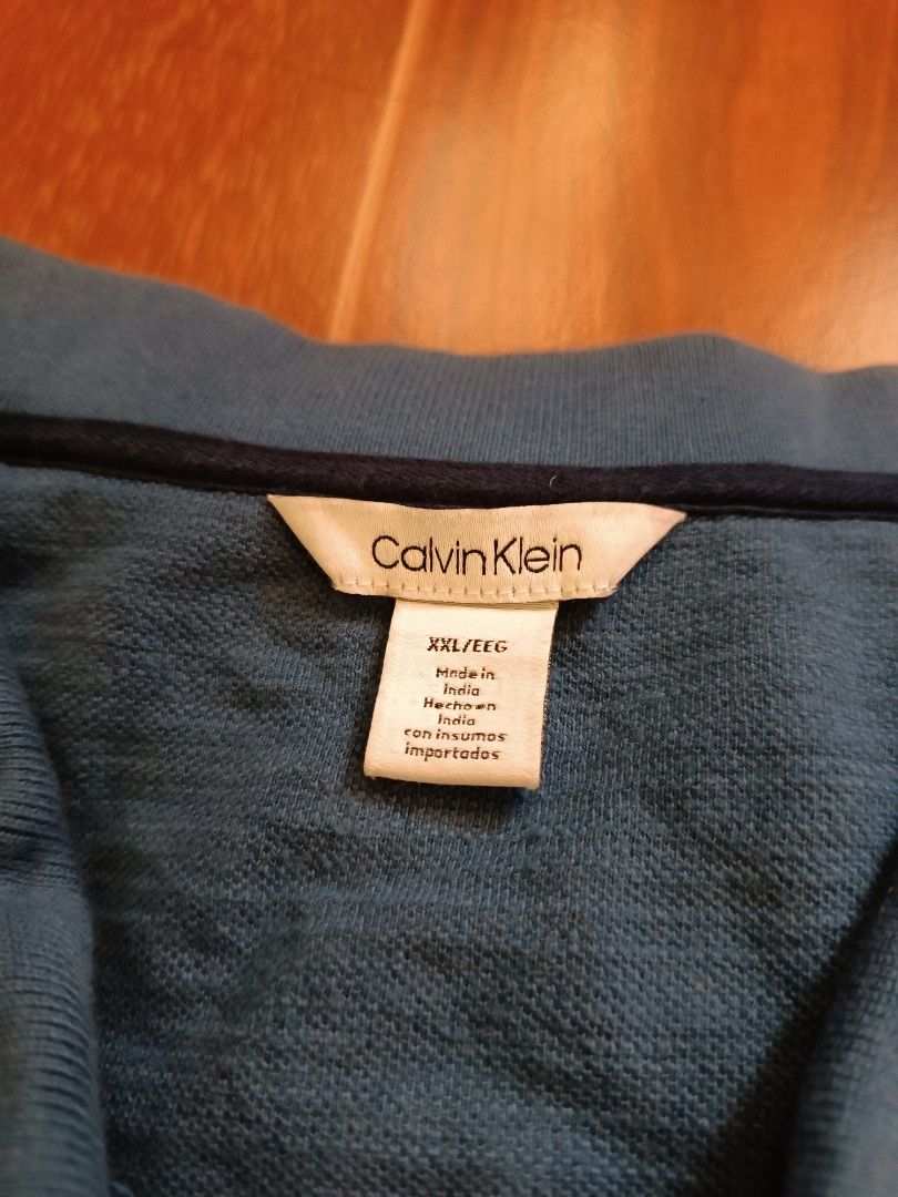 Calvin Klein polo shirt (Category: Tshirts & Polo Shirts ) located in San Pablo. Submitted by alem12 (Listing ID 1309461619, Image 2). Description: Calvin Klein 450 pesos Size XXL on tag 29x25 Issue medyo white sa neck, stain sa middle hindi masyadong visible 8.5/10 condition 📍San Pablo City Laguna Meet up, pick up or shipping (+sf).