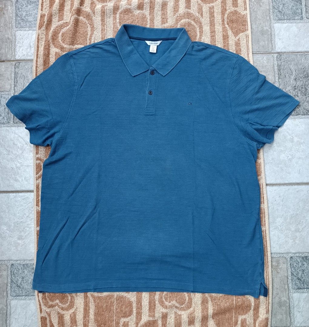Calvin Klein polo shirt (Category: Tshirts & Polo Shirts ) located in San Pablo. Submitted by alem12 (Listing ID 1309461619, Image 1). Description: Calvin Klein 450 pesos Size XXL on tag 29x25 Issue medyo white sa neck, stain sa middle hindi masyadong visible 8.5/10 condition 📍San Pablo City Laguna Meet up, pick up or shipping (+sf).